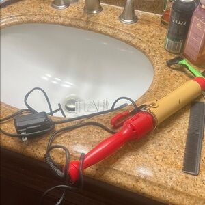Red and Yellow Curling Iron Chi works great just had a little kink on cord